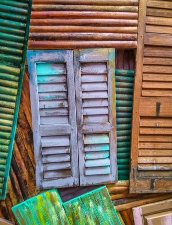 Old wooden window shutters of an Mediterranean house, vintage backgroundの写真素材