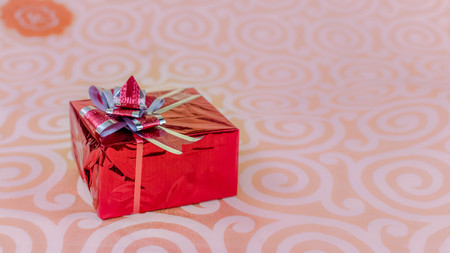 Valentines day concept with a gift on a textured background with copy spaceの写真素材