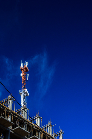 Telecom tower atop a under construction buildingの写真素材