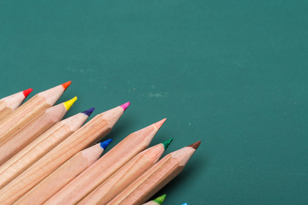 colorful pencils on blackboardの写真素材