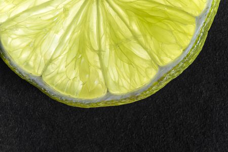 macro of green lime sliceの写真素材