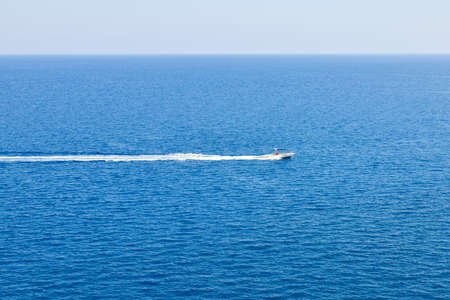 Speedboat on empty blue clear Mediterranean Seaの写真素材