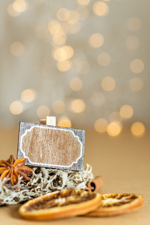 Christmas decoration with blank sign and warm festive bokeh lights in background as templateの写真素材