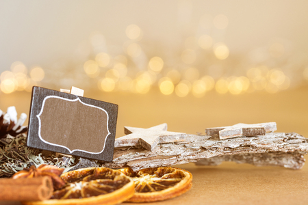 Christmas decoration with blank sign and warm festive bokeh lights in background as templateの写真素材