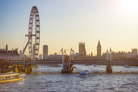 Cityscape of London with London big giant wheel, River Thames and Houses of Parliament with Big Ben at sunsetのeditorial素材