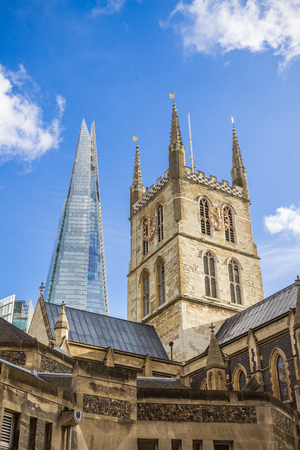The Shard in London behind a historical church symbolizing old vs newのeditorial素材