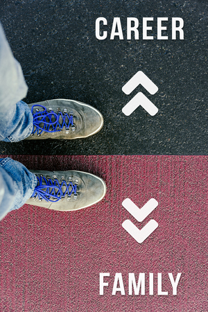 Reaching a crossroads having to choose between career and family and about future symbolized by two...