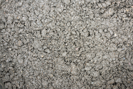 Bucket full of earth-moist concrete for construction as close-upの写真素材
