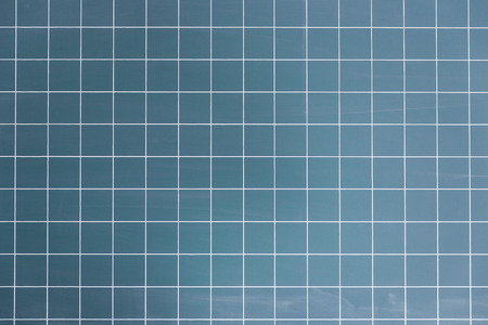 Closeup of empty blue blackboard with free copy space for text or image messages with checked...