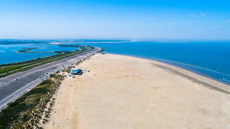 Aerial view taken at a beach and blue sea as seaside from zeeland in the Netherlandsの写真素材