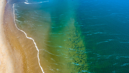 Aerial view taken at a beach and blue sea as seaside from zeeland in the Netherlandsの写真素材