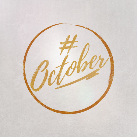 # Hashtag October written in orange on grey background as template in handwritten styleの写真素材