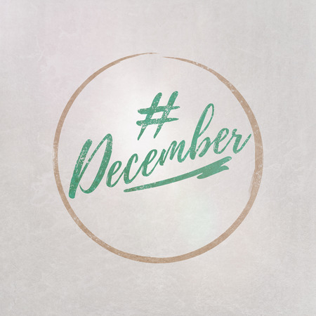 # Hashtag December written in green on grey background as template in handwritten styleの写真素材