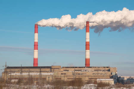Industrial, ecology and environmental pollution. The smoke from the chimney of the industrial plant.の写真素材