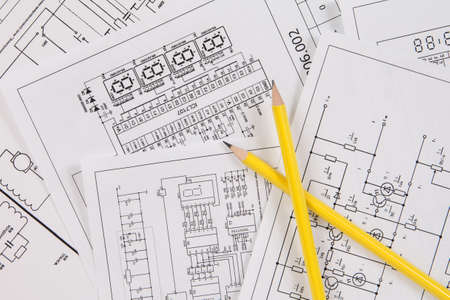 Two pencil and background of printed electrical drawingsの写真素材