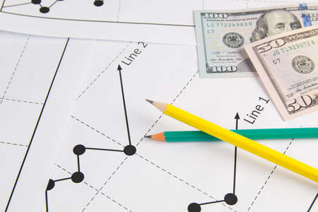 Business drawing chart graphics, pancils, usa dollars and notepadの写真素材
