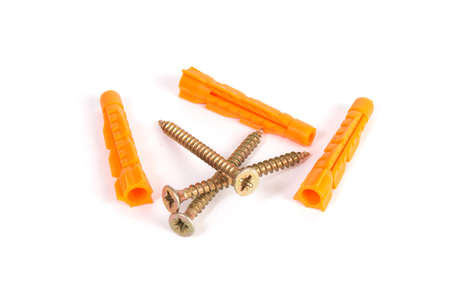 screws and plastic dowels on a white backgroundの写真素材