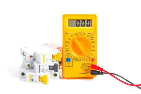 modular circuit breaker and digital multimeter on white background