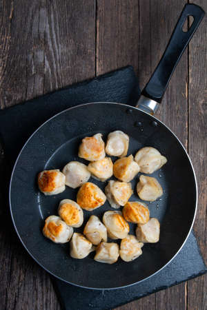 fried russian dumplings in a panの写真素材