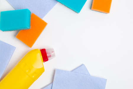 Cleaning product, cleaning wipes and sponges on white background. Top view with copy space.の写真素材