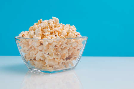 popcorn in a glass bowl with copy spaceの写真素材