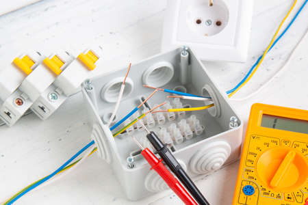 cutting box, digital multimeter, circuit breakers and installation of power supply systems