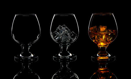 set of empty whiskey glass, with ice and whiskeyの写真素材