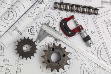Driving sprockets, caliper, chain, micrometer and engineering drawings of industrial parts and mechanismsの写真素材