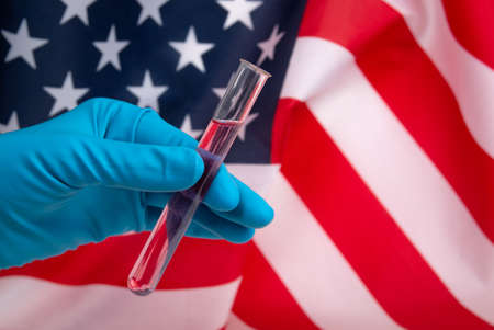 Medical test tubes on american flag background. Virus and and healthcare concept.の写真素材