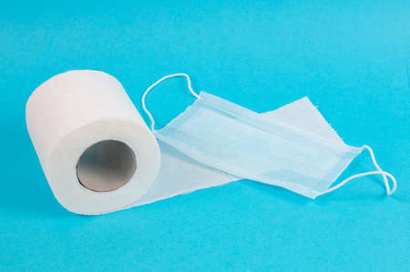 protective medical mask and roll of toilet paperの写真素材