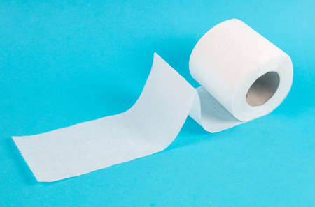 white toilet paper roll on blue backgroundの写真素材