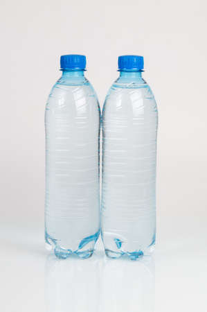 A half liter disposable plastic bottles with a blue capの写真素材