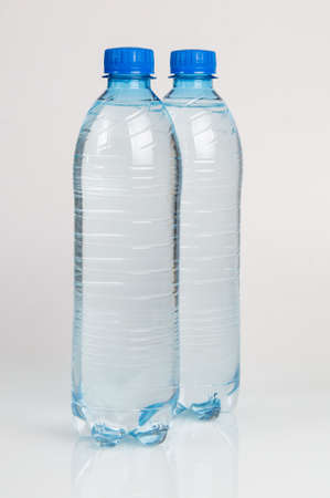 A half liter disposable plastic bottles with a blue capの写真素材