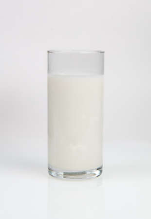 glass of natural healthy milk on white backgroundの写真素材