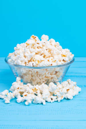 sweet popcorn on blue backgroundの写真素材