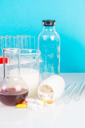 Glassware withliquids, pills, test-tube and flask for laboratory analysis. Laboratory medical research, chemical lab.の写真素材