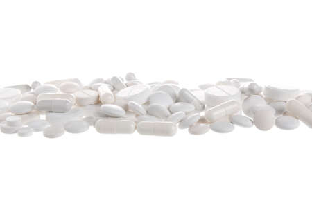 white medical pills and antibiotics on a white background