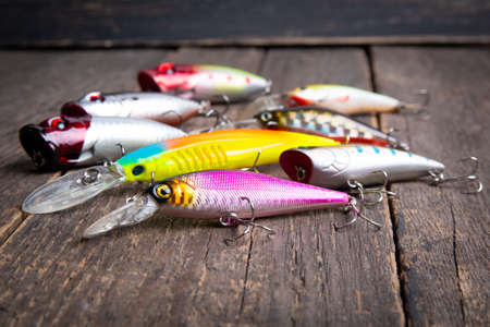 Fishing lures wobbler on a wooden tableの写真素材