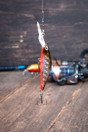 Fishing lures wobbler on a wooden tableの写真素材