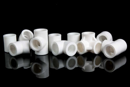 plumbing fittings for plastic pvc pipes on black backgroundの写真素材