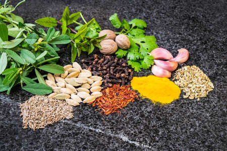 Asian curry spices on granite backgroundの写真素材