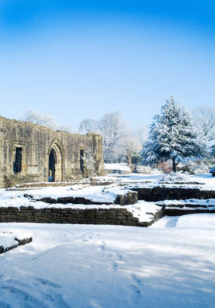 Snow on ruins at abbeyの写真素材