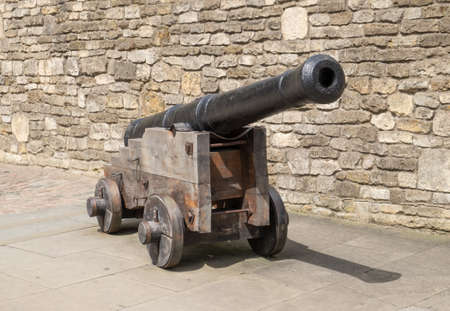 Old cannon on wooden gun carriageの写真素材