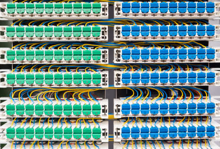 Broadband landline routing equipment, color coded neat wiring.の写真素材