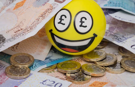 Happy money mad emoji face covered in british money