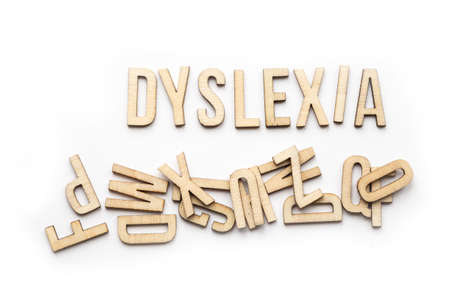 Aspergers spelled out with wood letters on white backgroundの写真素材