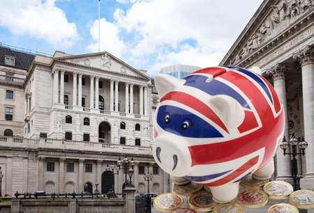 UK piggy bank in front of Bank of Englandのeditorial素材