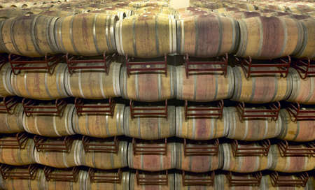 Wine barrels in an aging process at spanish cellarの写真素材