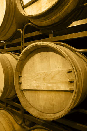 Wine barrels in an aging process at spanish cellarの写真素材