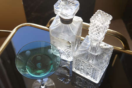 Fine Glass bottles on rolling bar table aerial view の写真素材